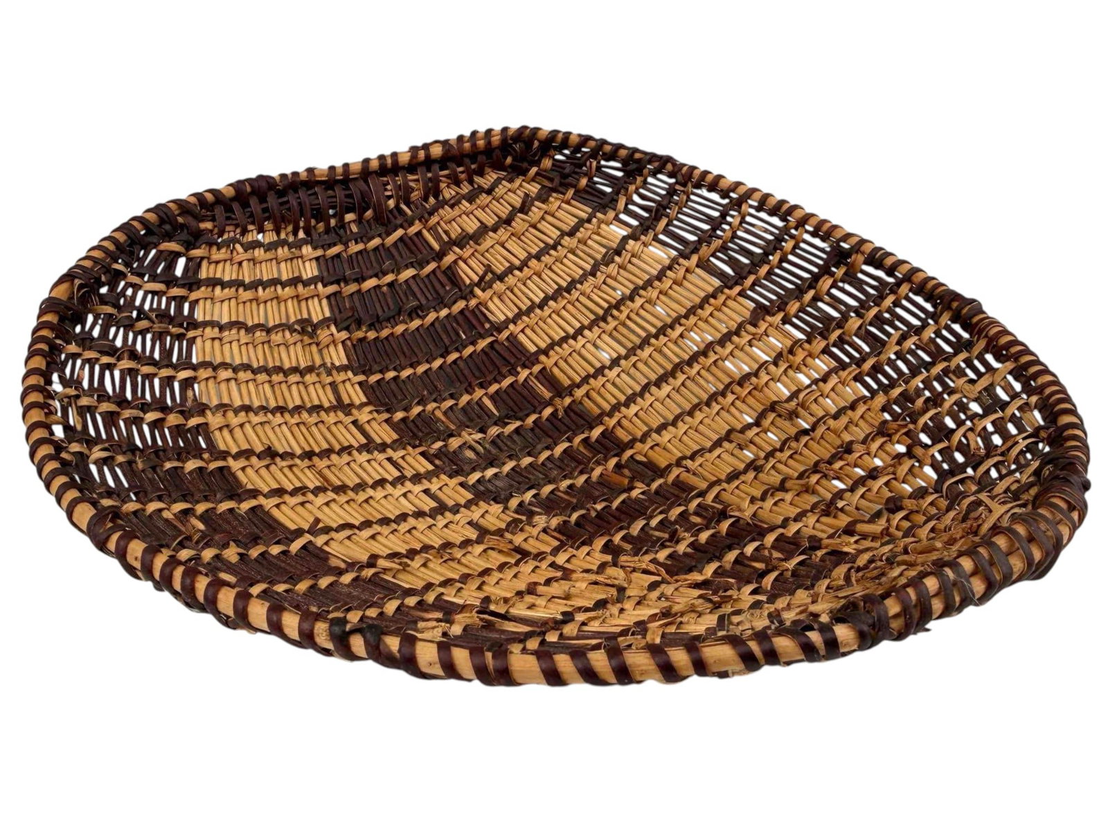 Miwok Native American Twined Basket: Native American twined basket, possibly Southern Miwok, featuring a bold geometric design in dark and natural fibers. Accompanied by a handwritten collection tag reading: "Seed beater, twined basket