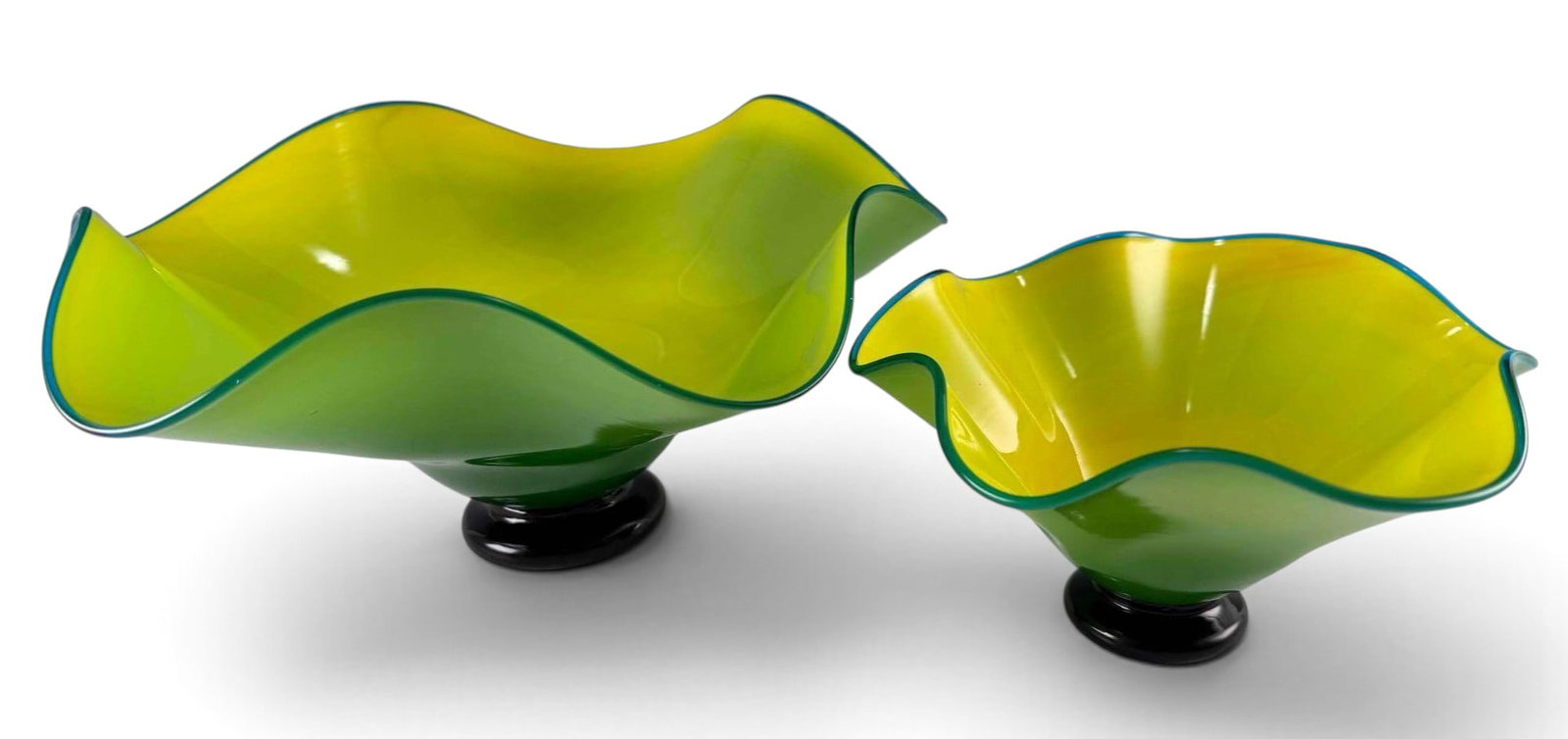 Two California Studio Art Glass Bowls: Two California Studio Art Glass Bowls. Signed "Strini." Marked "M03." Approximately 6.5H x 14.0W in. and 4.5H x 8.87W in.