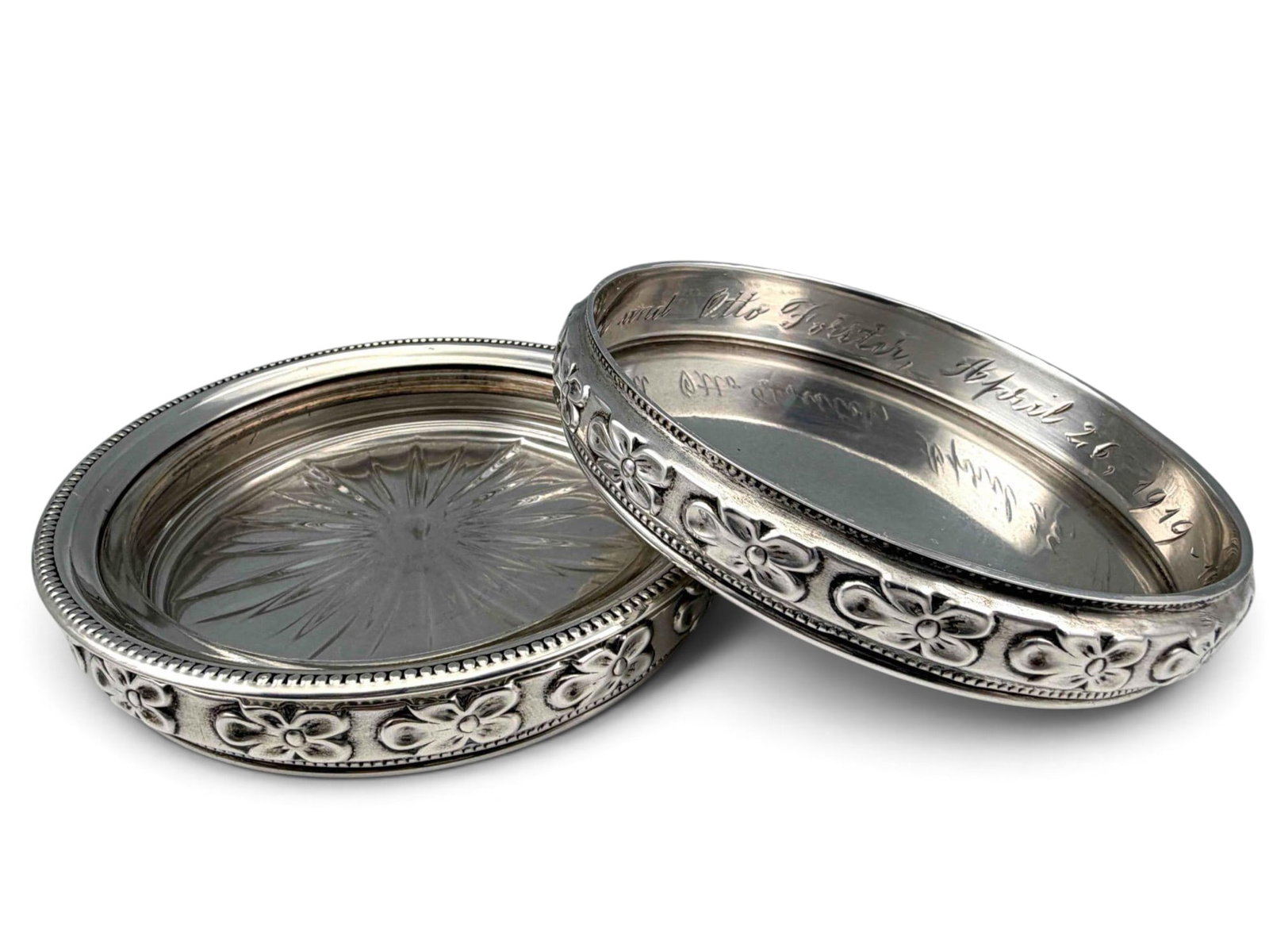 Pair Of Sterling Silver Wine Coasters: Pair Of Sterling Silver Wine Coasters. Weight excluding glass liner, 131.1g. Marked "STERLING," and "Ed. San Giovanni." Interior inscribed "Lyson and Otto Forster April 26, 1919-1944." Each
