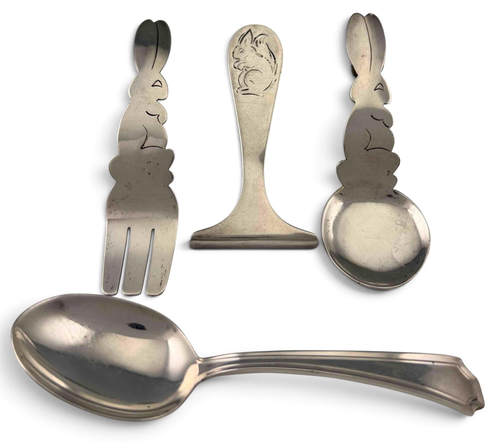 Sterling Silver Bunny & Squirrel Baby Serving Pieces: Sterling Silver Bunny & Squirrel Baby Serving Pieces, 67.1g. Bunny fork and spoon marked "Sterling Handmade." Baby food pusher unmarked, tests as sterling. Second spoons marked "Gorham Sterling."