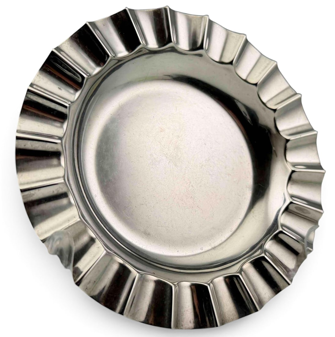 Sterling Silver Dish With Ruffled Edge: Sterling Silver Dish With Ruffled Edge, 63.7g. Marked "Smith & Smith Sterling 102." Approximately 4.75W x 0.5H in. ALL CREDIT CARDS WILL BE MANUALLY VERIFIED PRIOR TO SHIPMENT.