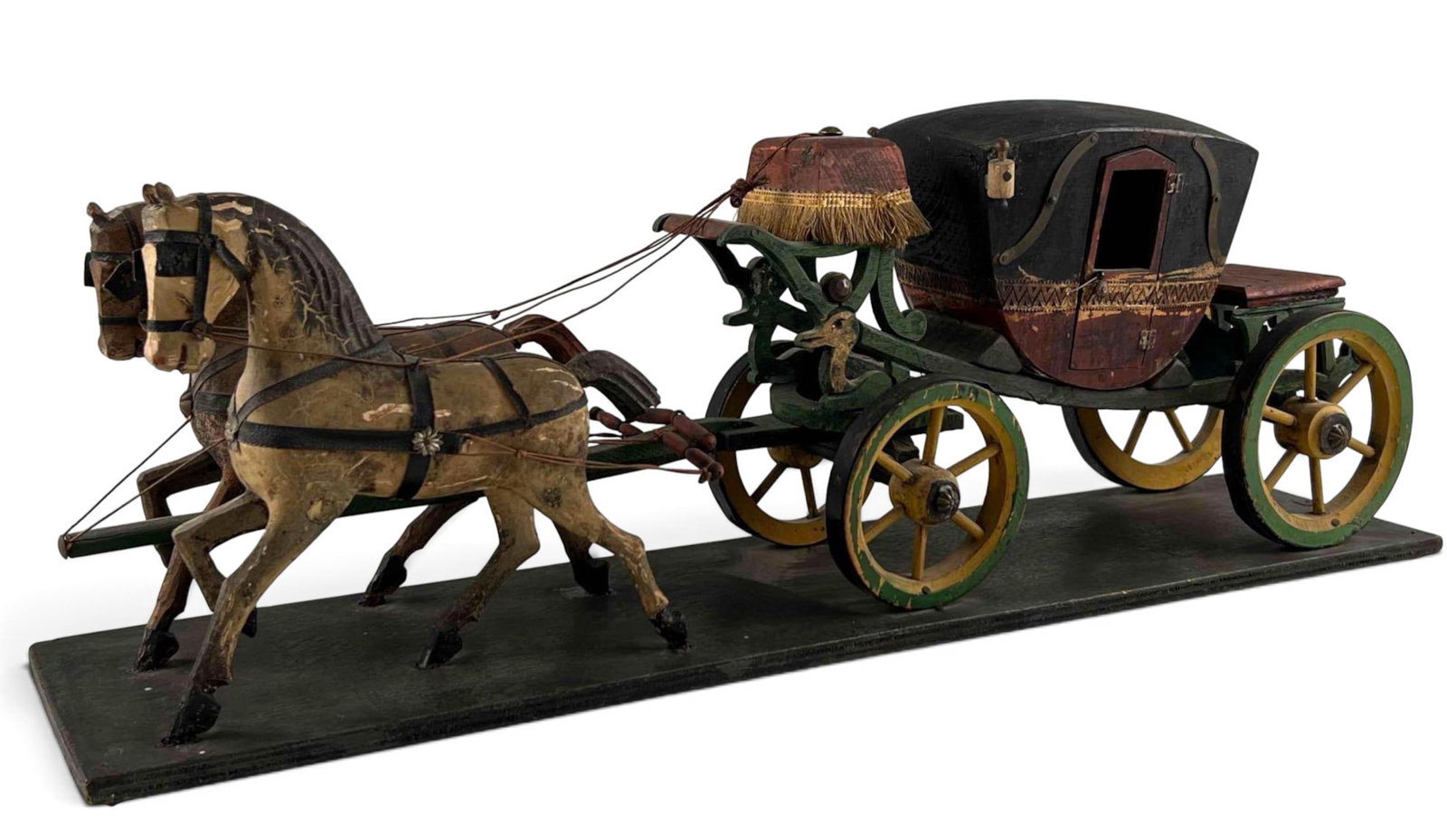German Wooden Stagecoach Model: German Wooden Stagecoach Model. Marked "Made In Germany." Approximately 24.25L x 8.5H x 5.5W in.