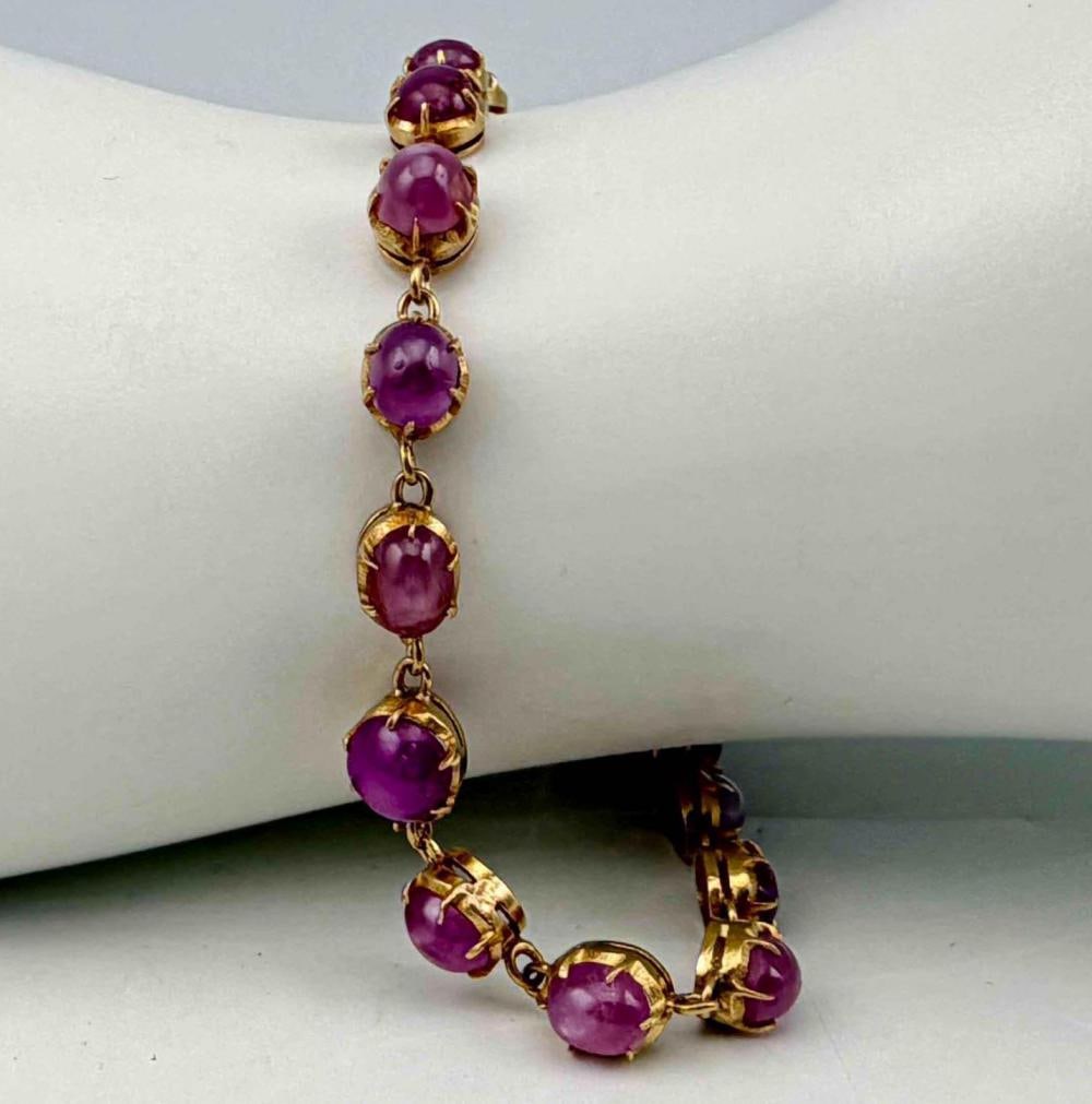 18k Gold Pink Star Sapphire Bracelet: 18k Gold Pink Star Sapphire Bracelet with 14k clasp & chain, 8.3g. Marked "14KT." Sapphires approximately 4.2W x 4.8H mm. ALL CREDIT CARDS WILL BE MANUALLY VERIFIED PRIOR TO SHIPMENT.