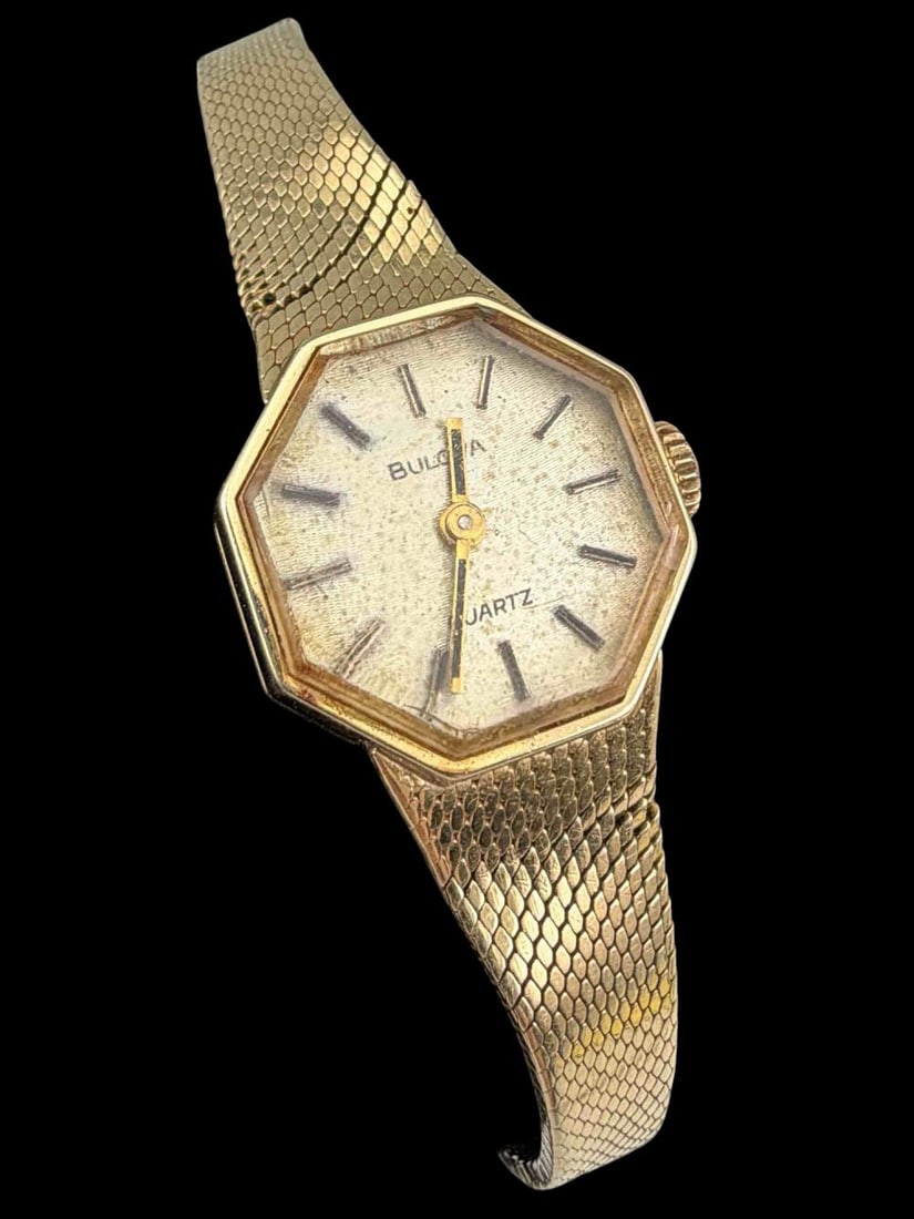 Ladies 14k Bulova Watch: Ladies 14k Bulova Watch, 17.1g. Marked "BULOVA N9 14K." Case approximately 16.5mm. Note the watch band is kinked on each side. Maximum inner circumference of band approximately 5.0in. Width of band