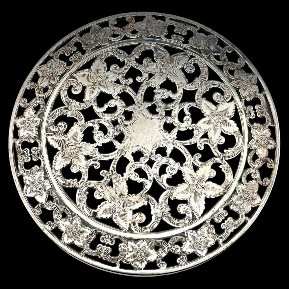 American Sterling Silver & Glass Trivet: American Sterling Silver & Glass Trivet. Marked "Webster Sterling." Approximately 6.0in. ALL CREDIT CARDS WILL BE MANUALLY VERIFIED PRIOR TO SHIPMENT.