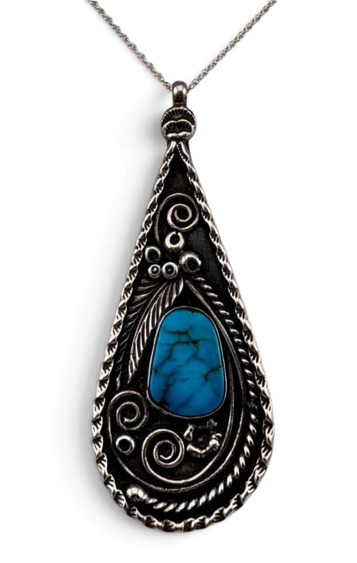 Old Pawn Native American Tear Drop Pendant With Tobacco Leaf Detail: Old Pawn Native American Tear Drop Pendant With Tobacco Leaf Detail, 24.1g. Pendant unmarked, tests as sterling silver. Pendant approximately 2.95L x 1.15W in. Chain length approximately 18.0in.