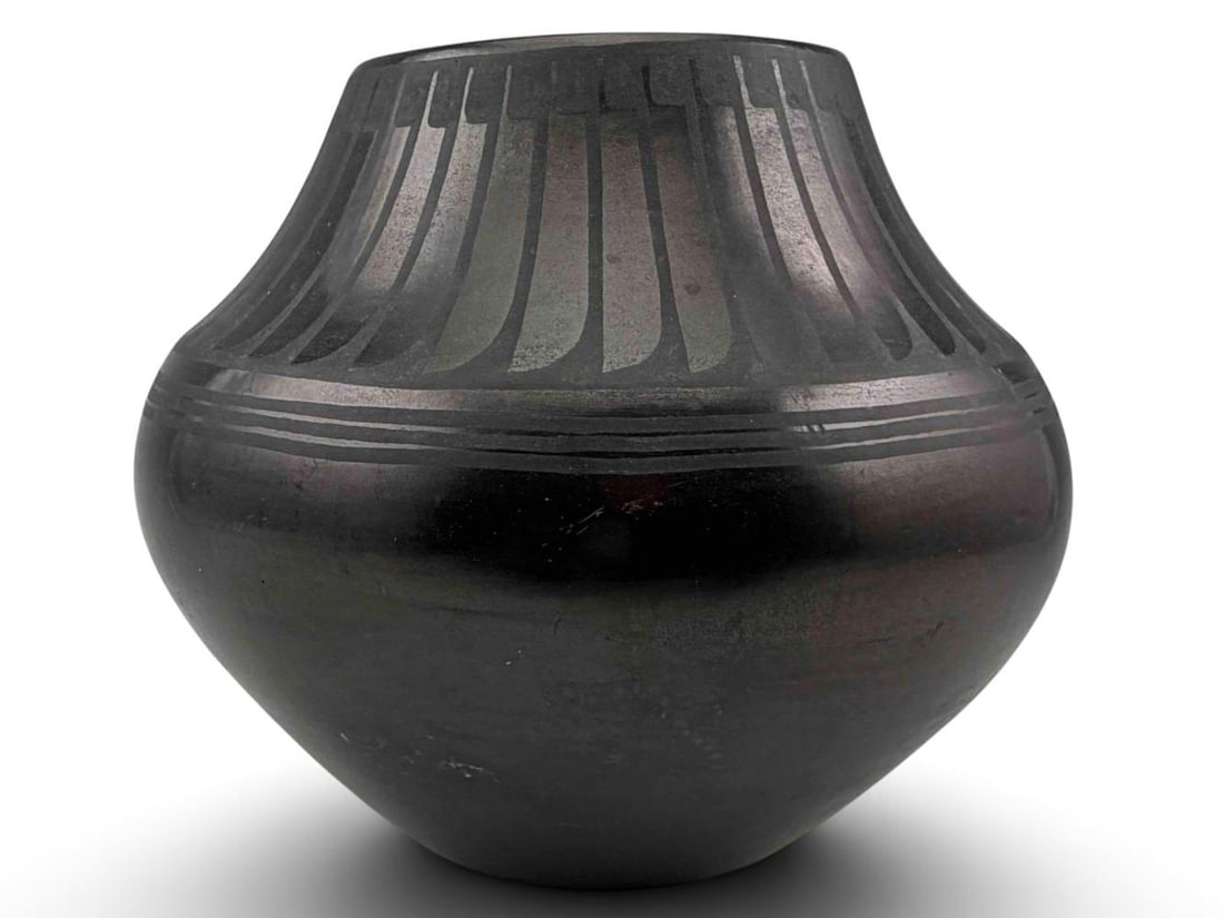 Maria & Julian Martinez, San Ildefonso Pueblo Blackware Feather Pot: San Ildefonso Pueblo Blackware Feather Pot by. Maria Martinez (1887 -`980) & Julian Martinez (1885 - 1943). Features the classic polished black finish with matte carved feather design encircling the s