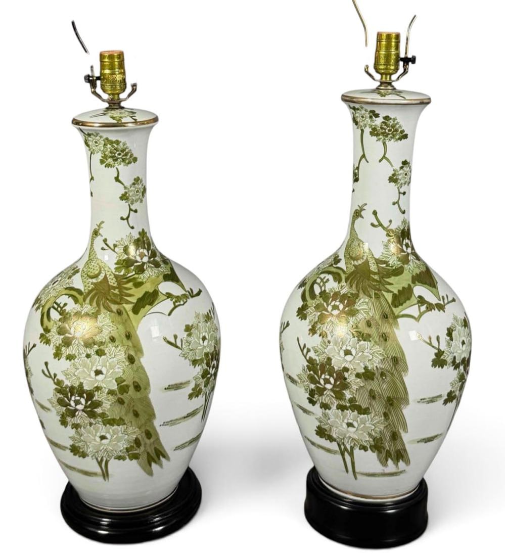 Near Pair Asian Porcelain Table Lamps, Peacock and Floral Decoration: Near pair of Asian porcelain table lamps, each in a tall baluster form with white ground and extensive hand-painted decoration in shades of green. The bodies feature peacocks among flowering