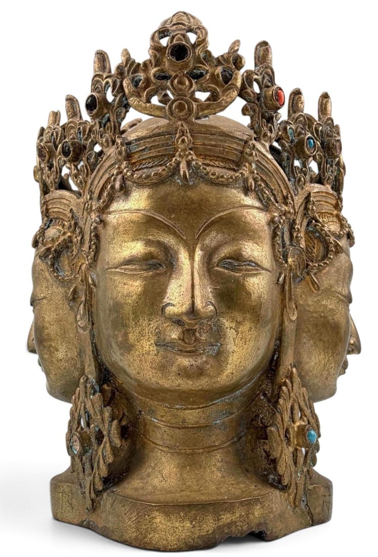 Finely cast gilt bronze head of Avalokiteshvara: Tibetan Bronze Multi-Faced Head of Avalokiteshvara. Finely cast gilt bronze head of Avalokiteshvara (Chenrezig), the Bodhisattva of Compassion. Underside is hallow & open as is typical for consecrated