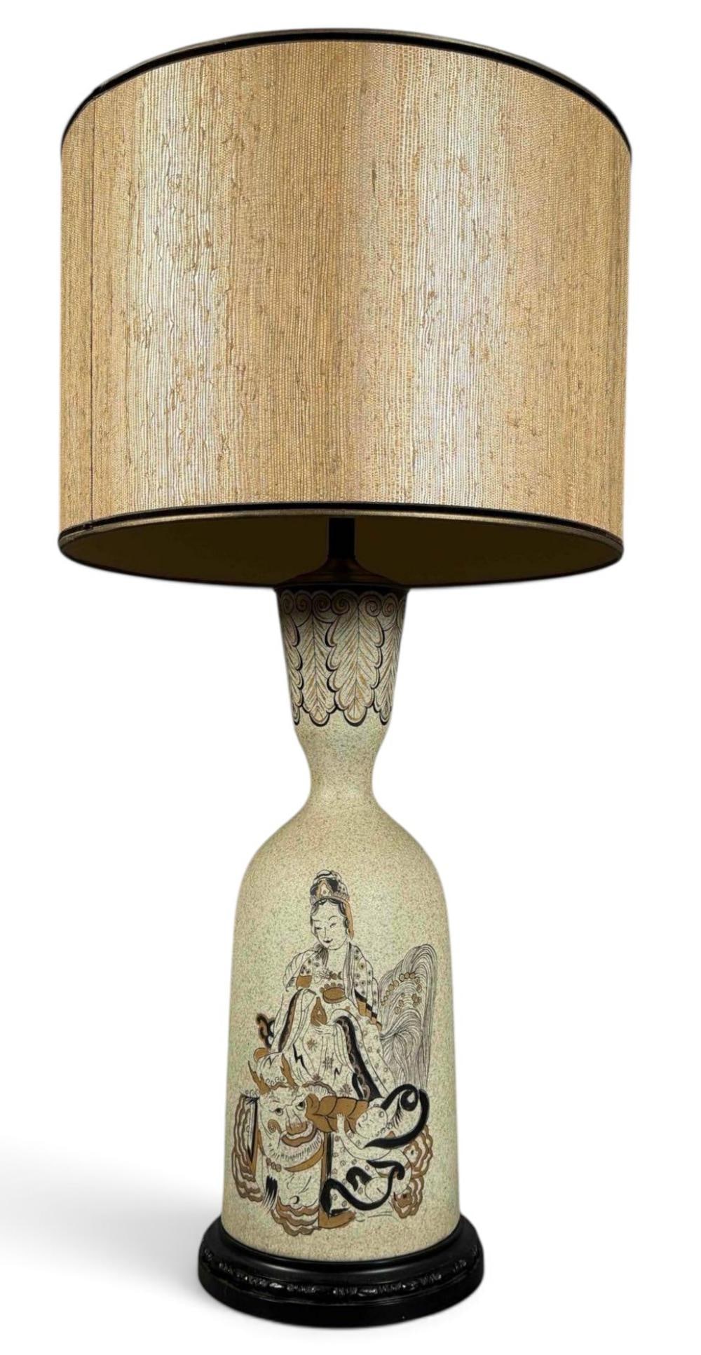 Mid-Century Chinoiserie Ceramic Table Lamp, Asian Deity with Dragon and Tiger: Mid-century ceramic table lamp featuring a tall, elongated bottle-form body with a cream-colored, textured finish. The body is decorated with a detailed Asian figural scene depicting a seated female