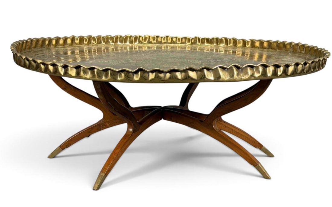 Vintage Mid-Century Modern Brass Tray Top Table: Vintage mid-century modern tray-top table featuring an oval brass tray with a hand-hammered surface and scalloped, pie-crust edge on a spider leg base. Approximately 44.25W x 17.5H in.