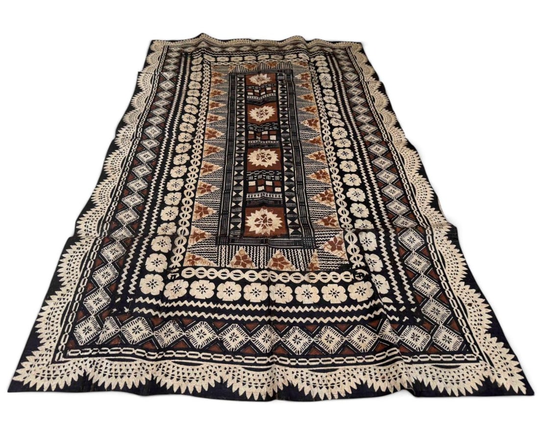 Fijian Masi Kesa Tapa Cloth: Traditional Fijian masi kesa decorated with an intricate arrangement of geometric, floral & repeating motifs in black, brown, & natural tones often accoiated with the Namuka-i-Lau. Approximately