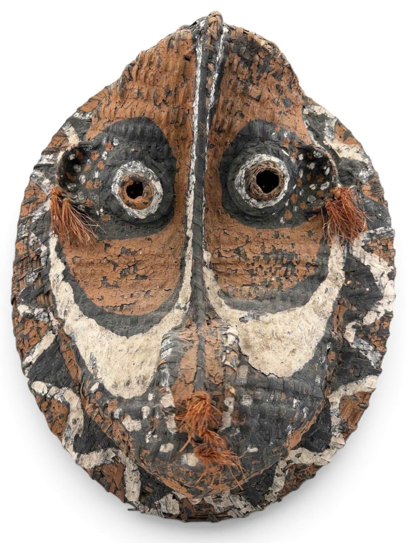 Papua New Guinea Woven Fiber Mask: Papua New Guinea woven fiber mask, 20th century. Approximately 20.0H x 14.0W in.