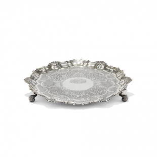 Silver salver: Silver salver William Grundy, London, 1745 Circular, shaped, engraved with trellis and vegetal scrolls. 1780 g circa 1.6 x 15.9 x 15.9 in.
