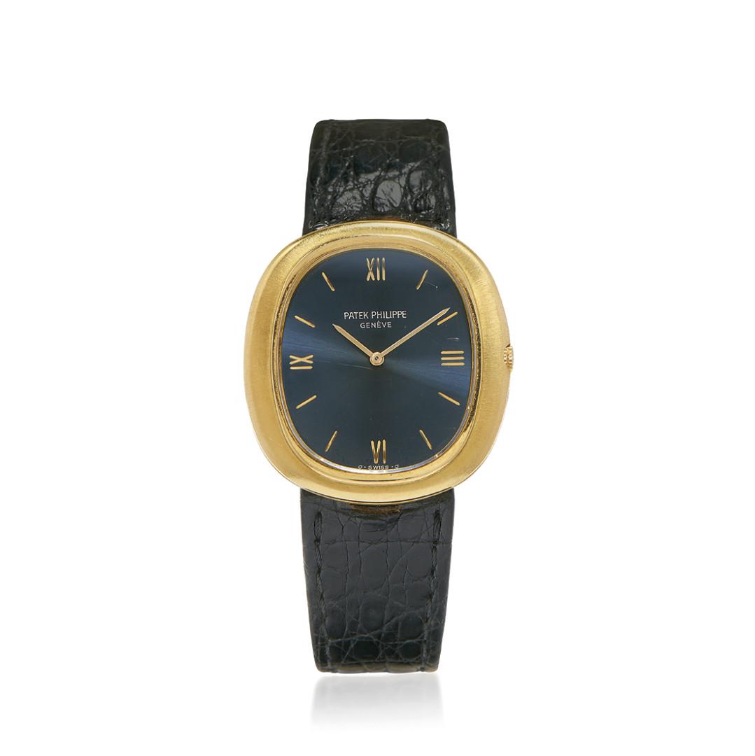 GOLD PATEK PHILIPPE ELLIPSE REF. 3589 AUTOMATIC, BOX AND PAPER, SOLD IN 1971: GOLD PATEK PHILIPPE ELLIPSE REF. 3589 AUTOMATIC, BOX AND PAPER, SOLD IN 1971 Case: signed, n. 521296, two-body in 18K gold, central hooded lugs, snap on caseback. Bracelet/Strap: signed strap, 18K gol