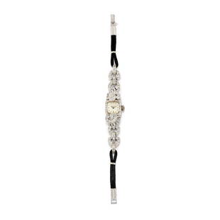 LADYâ€™S DIAMOND WRISTWATCH, HAMILTON: LADYâ€™S DIAMOND WRISTWATCH, HAMILTON in platinum with square dial and case highlighted with diamonds of various cuts forming a curl motif, present also on the bracelet links, ending with black