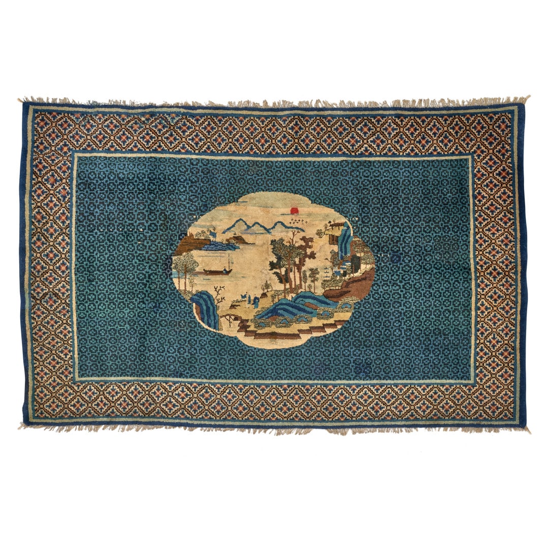 Carpet China, Baotou, 20th century: The centre with a polylobed medallion with a landscape with a figure reserved on a ground of stylised flowers, border with floral decoration. 50.4 x 78.7 in.