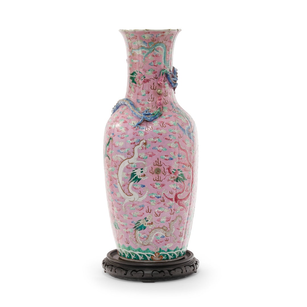 Large baluster vase China, Qing dynasty, 19th century: Porcelain molded in light shells and painted with polychrome enamels and touches of gold, pink ground with decoration of dragons chasing the Pearl in flight amidst clouds and darts, stylized waves at