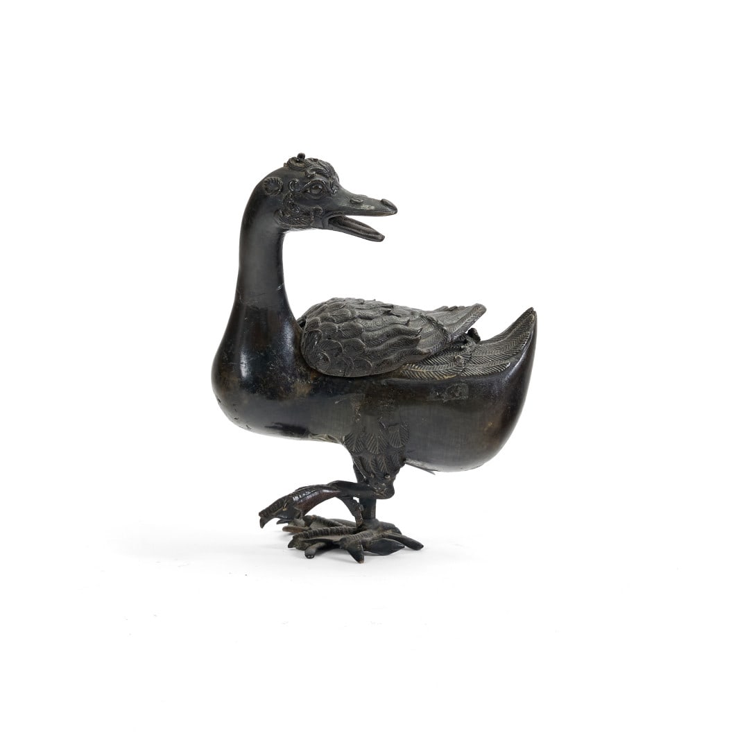 Incense burner China, Qing dynasty, 17th-18th century: Bronze, modeled in the form of a duck with its neck and beak pointing backwards, its left leg raised, the feathers on its back, the flanks and head with incised details. 7.5 x 3.5 x 5.9 in.