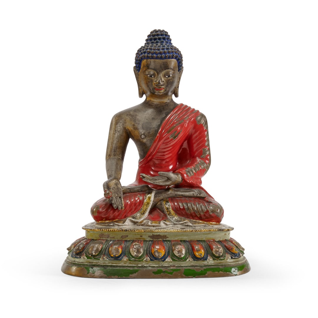 Buddha Tibet, 18th-19th century: Painted bronze, the deity seated cross-legged on a lotus flower base, the left hand at lap level, a small sphere between the index finger and thumb of the right hand. 5.9 x 4.7 x 3.5 in.