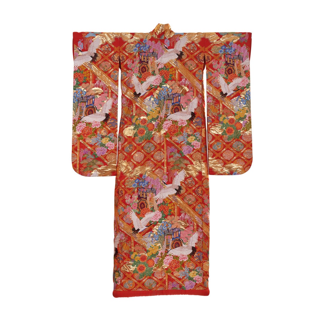 Female kimono, furisode Japan, 20th century: Padded silk, red ground with an exuberant polychrome and gold decoration with cranes, stylised flowers and sedan chairs. 78.7 x 51.2 in.