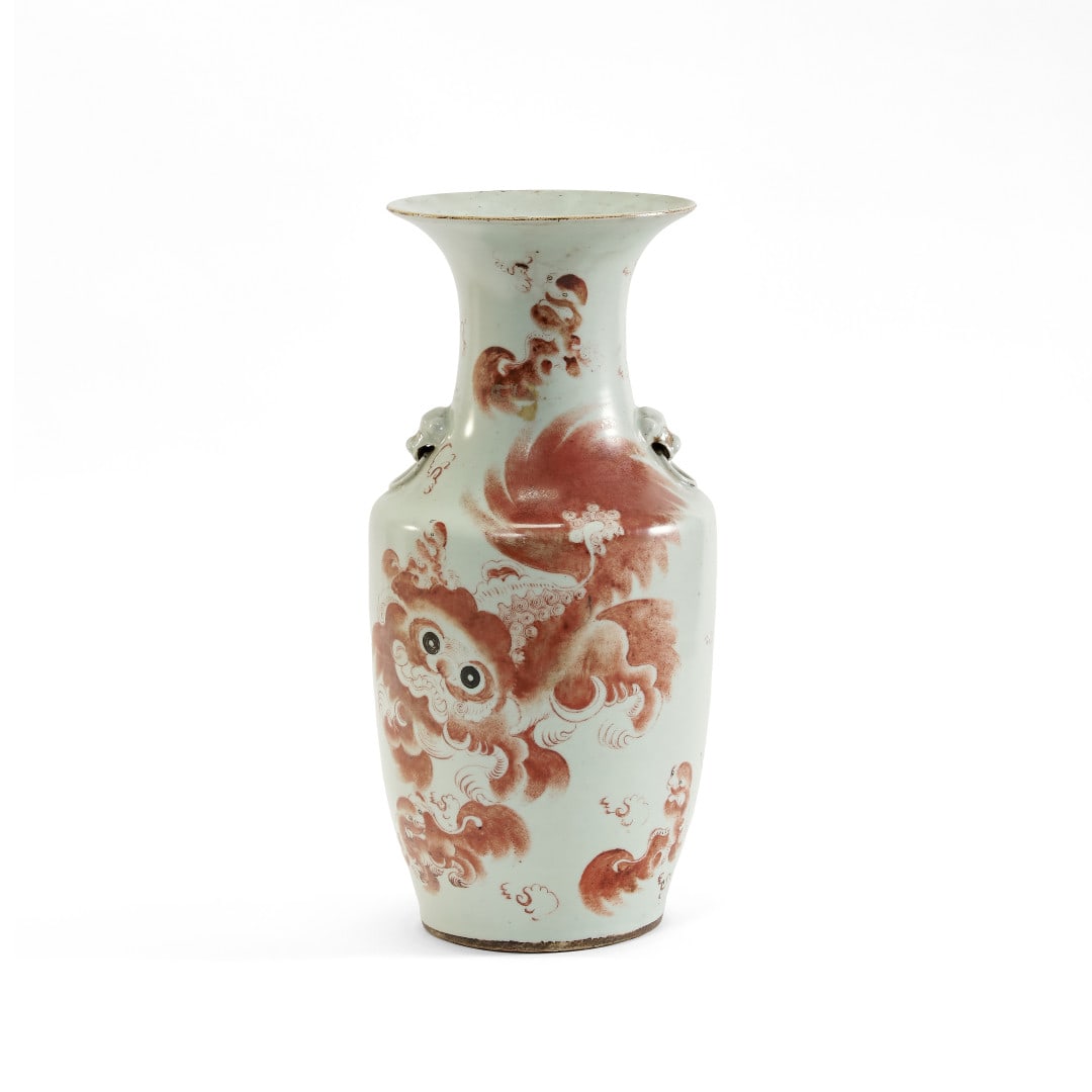 Balauster vase China, 20th century: Porcelain with red decoration of Buddhist lions and inscriptions, lion-head handles. 16.9 x 8.3 in.