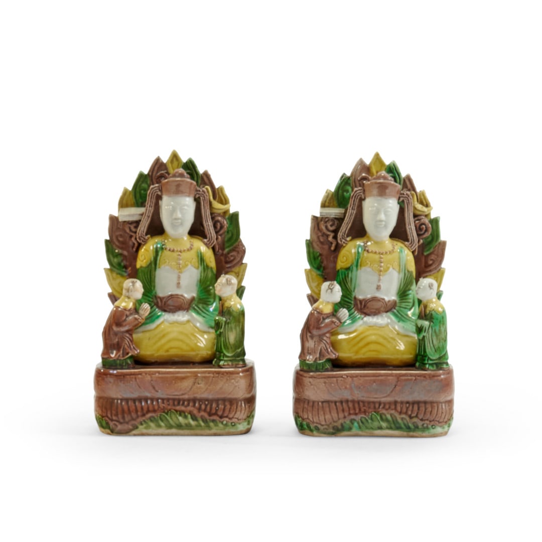 Two buddhist groups China, 20th century: Porcelain with three-color glaze (sancai), each with the Buddha and two disciples, on the reverse a flaming halo. 8.1 x 4.3 x 2.8 in.
