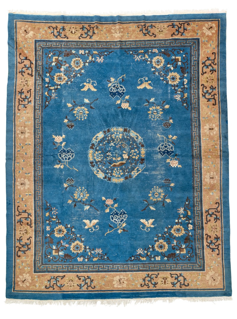 Carpet China, early 20th century: The large central panel with a blue ground and floral decoration, enclosed within an ochre ground border with floral arabesques. 145.7 x 50.4 in.