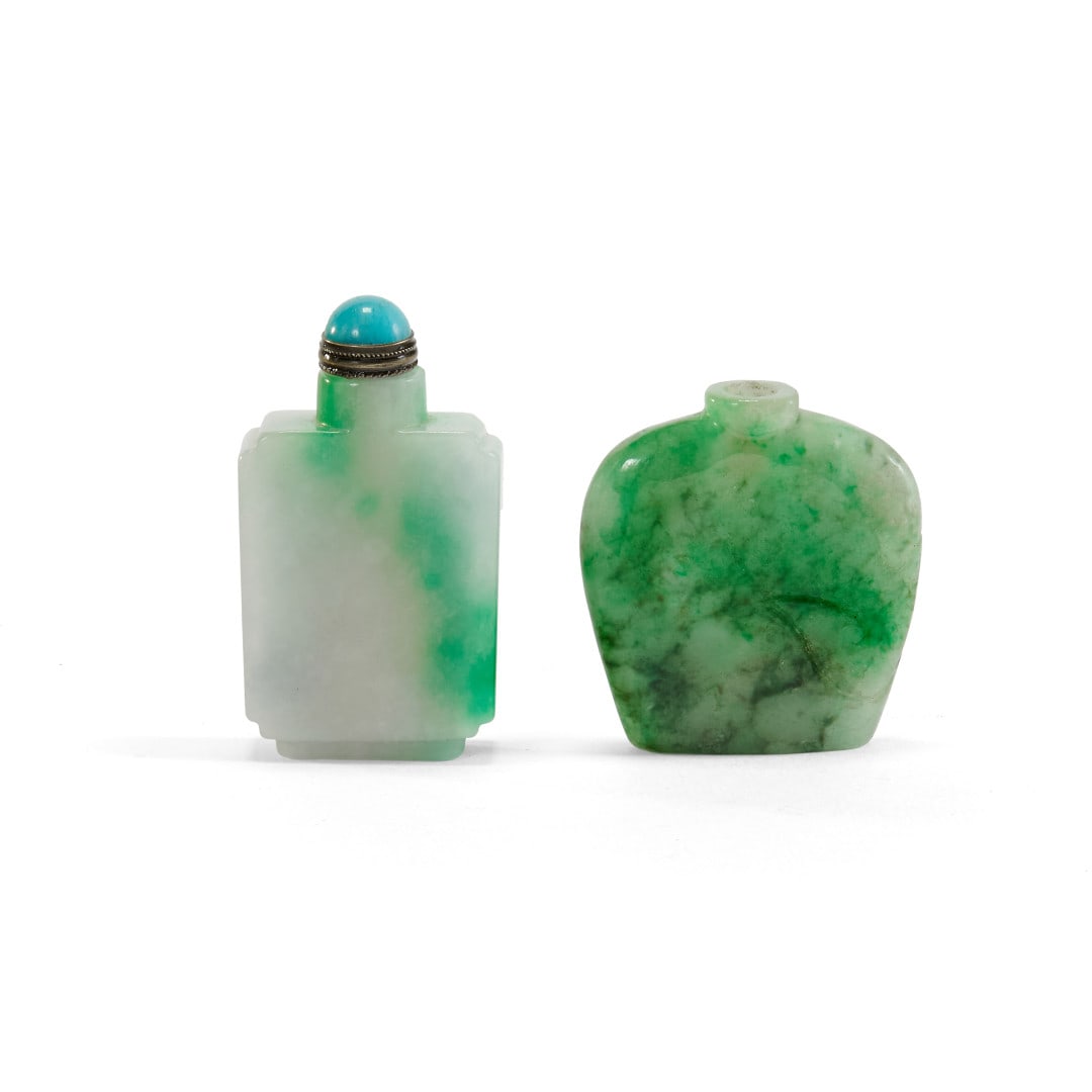 Two snuff bottles China, 20th century: Jadeite, one with a light blue stopper. 2.2 x 1.3 x 0.4 in.