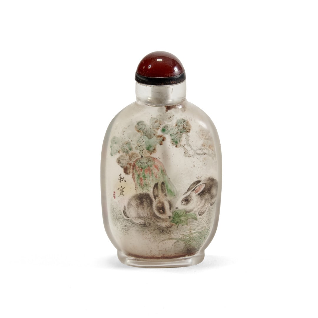 Snuff bottle China, 20th century: Painted reverse glass, one side with a composition of flowers in vases with an inscription and seal, the other with a scene of two hares in a landscape with a signature and seal. 3.7 x 2 x 1 in.