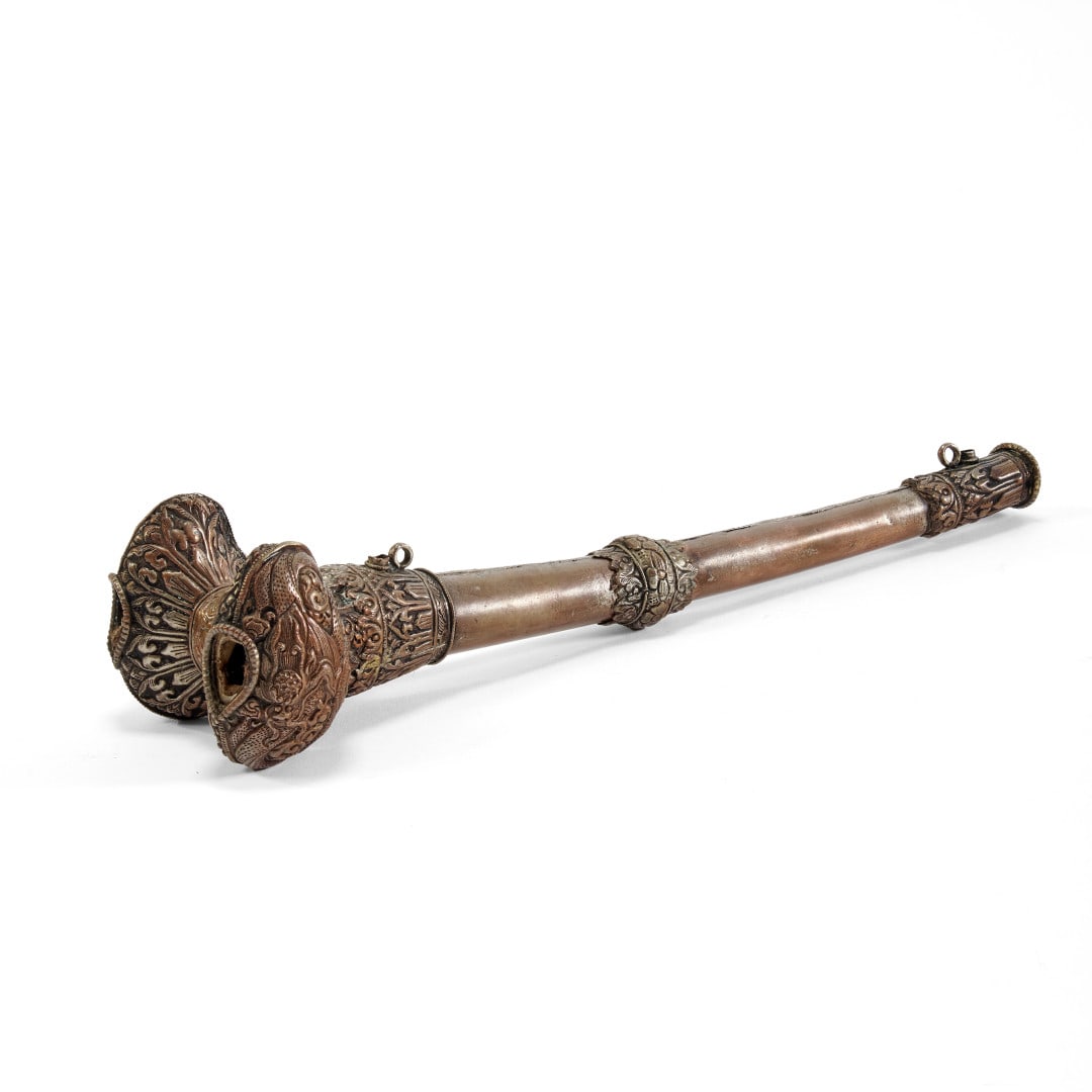 Ritual trumpet, kangling Tibet, 20th century: Bone covered with copper sheet with a relief decoration. 2.8 x 3.9 x 13.8 in.