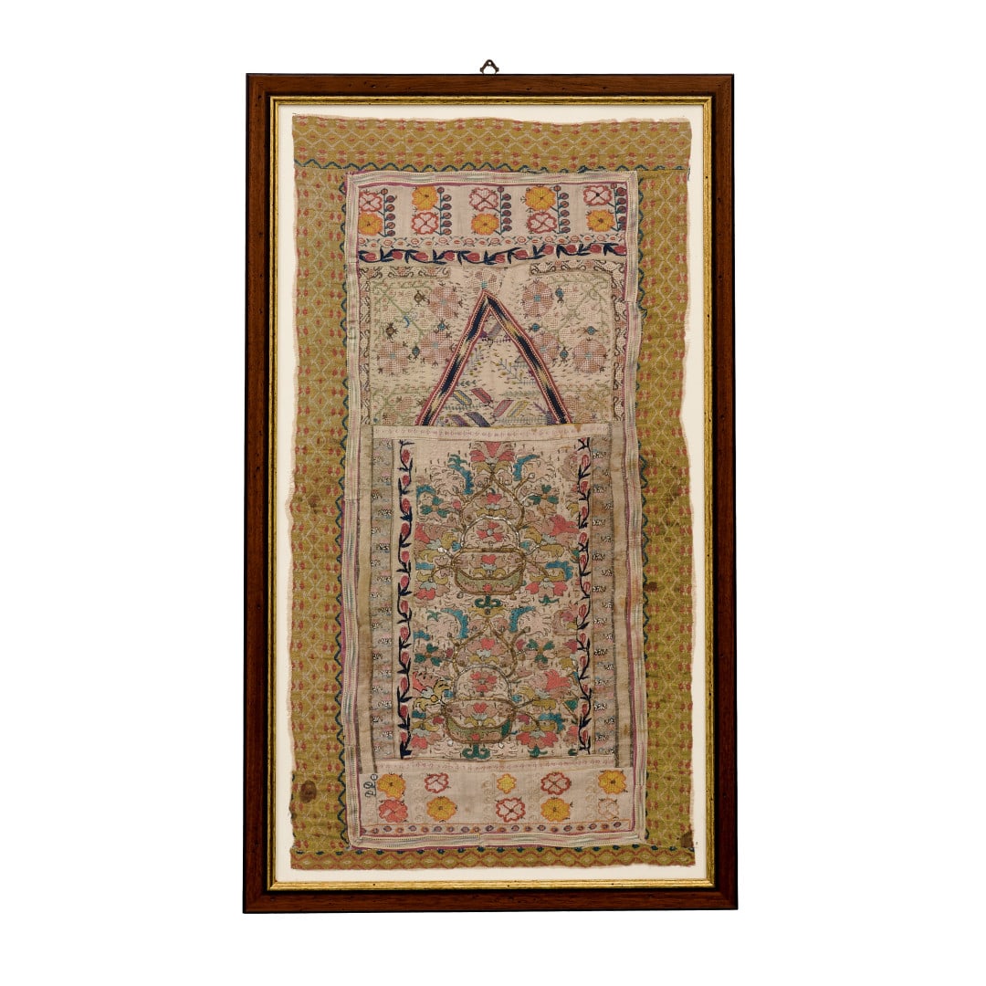 Four fabrics India (?), 19th-20th Century: Embroidery with polychrome and gold threads, floral motifs, wooden frame and protective glass. Measures including the frame. 41.3 x 24 in.