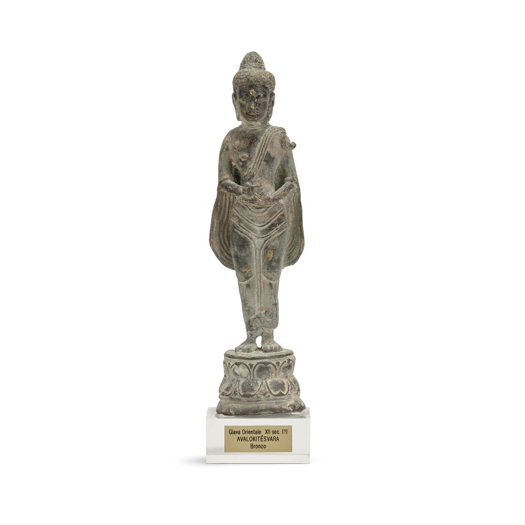 Standing bodhisattva Indonesia, 20th century: Bronze with light green patina, the Buddhist deity standing on a double lotus flower base. 11 x 2.8 x 2.4 in.