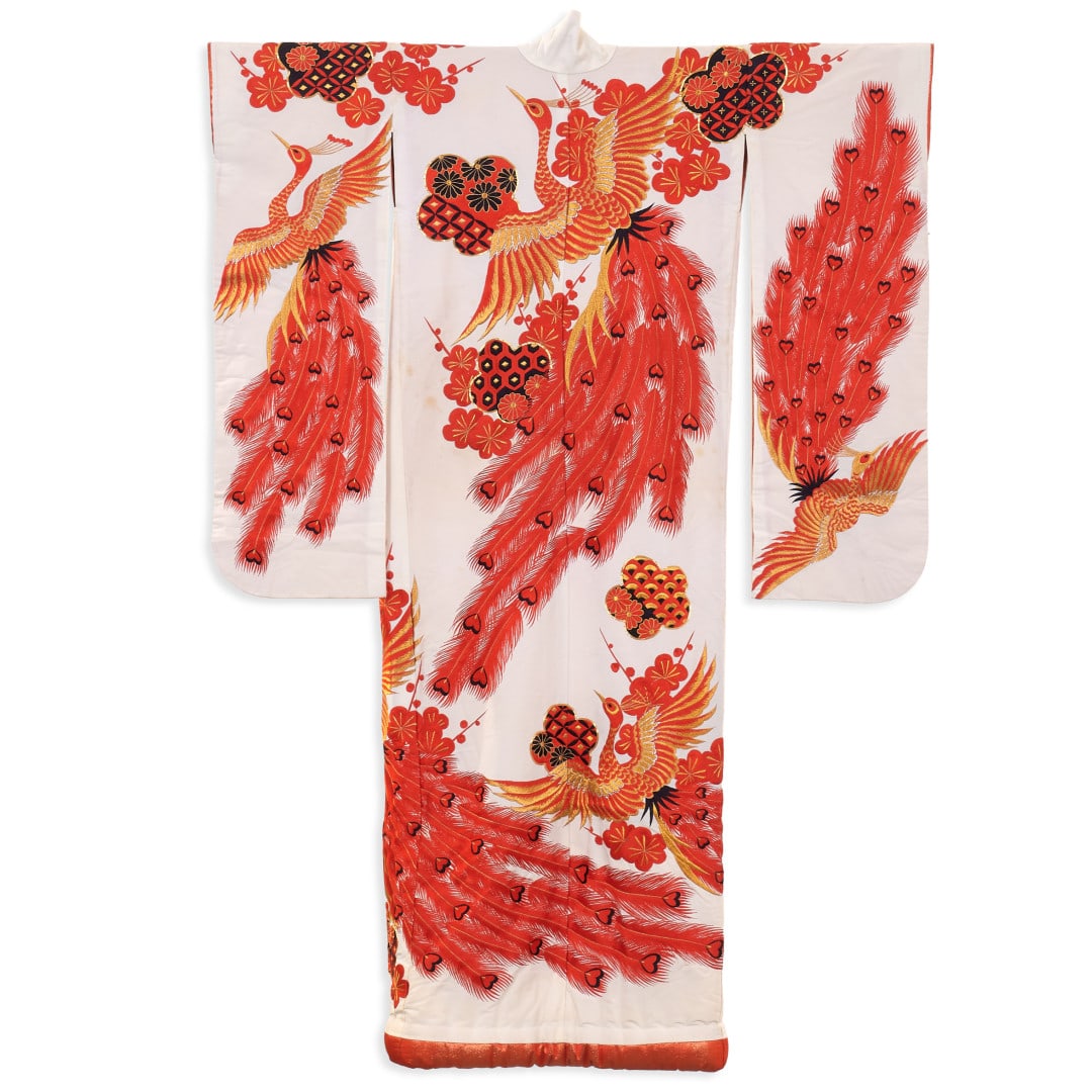 Female kimono, furisode Japan, 20th century: Padded silk, white ground with decoration of stylised flowers, peacocks in red, black and gold. 72.8 x 51.2 in.