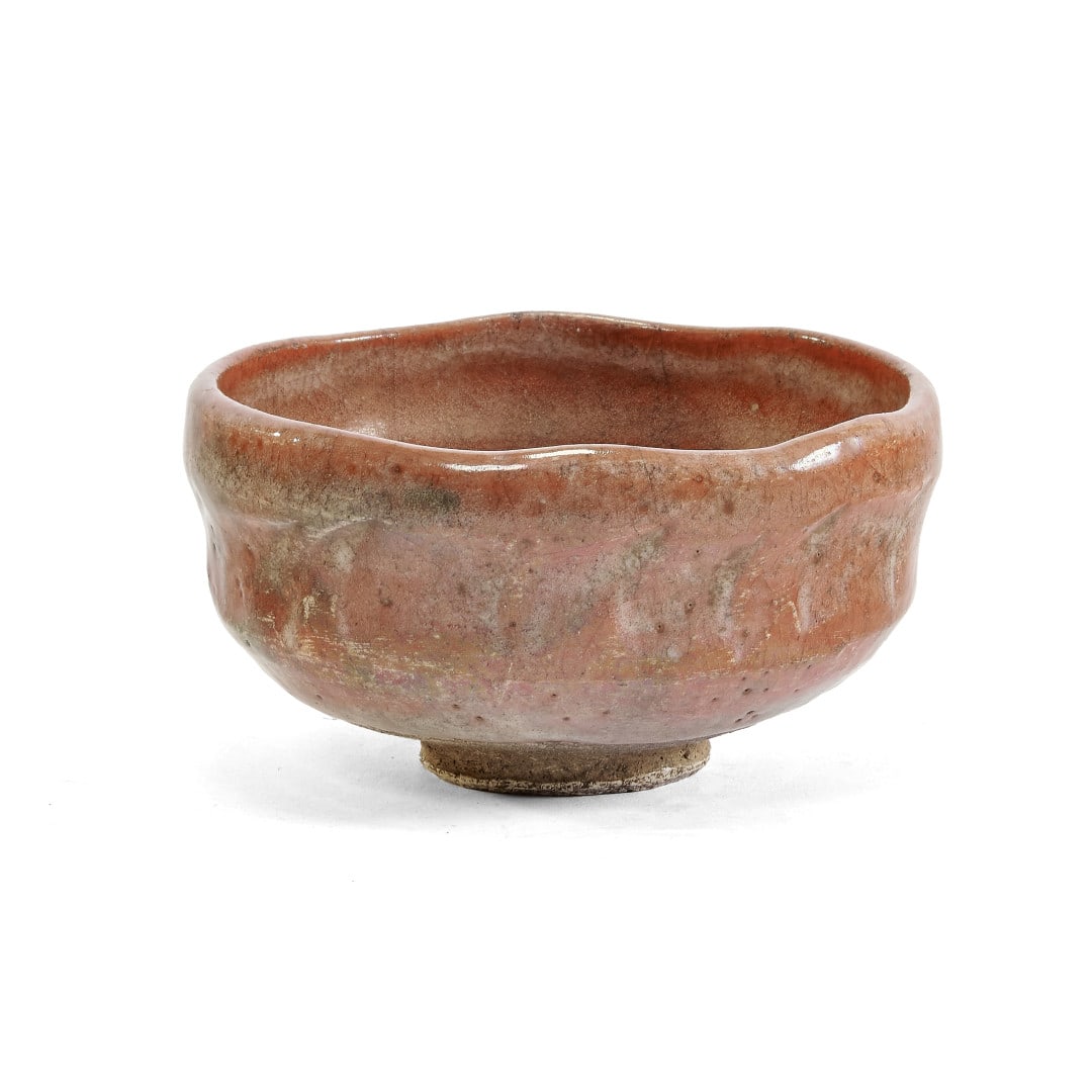 TEA BOWL Japan, 20th century: Ceramic with Raku-type red glaze. 2.8 x 4.9 in.