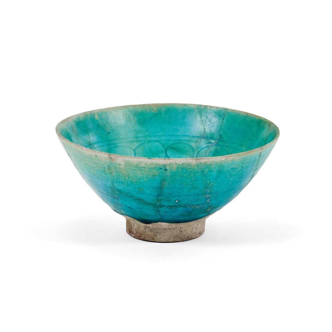 Bowl Persia, 13th century: Ceramic with turquoise glaze, stylised incised decoration on the bottom. Restorations. 3.1 x 6.7 in.