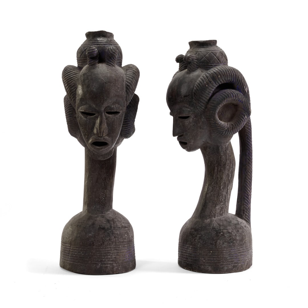 Pair of heads Nigeria, Beni, 20th century: Carved wood. 22.4 x 6.7 x 7.9 in.
