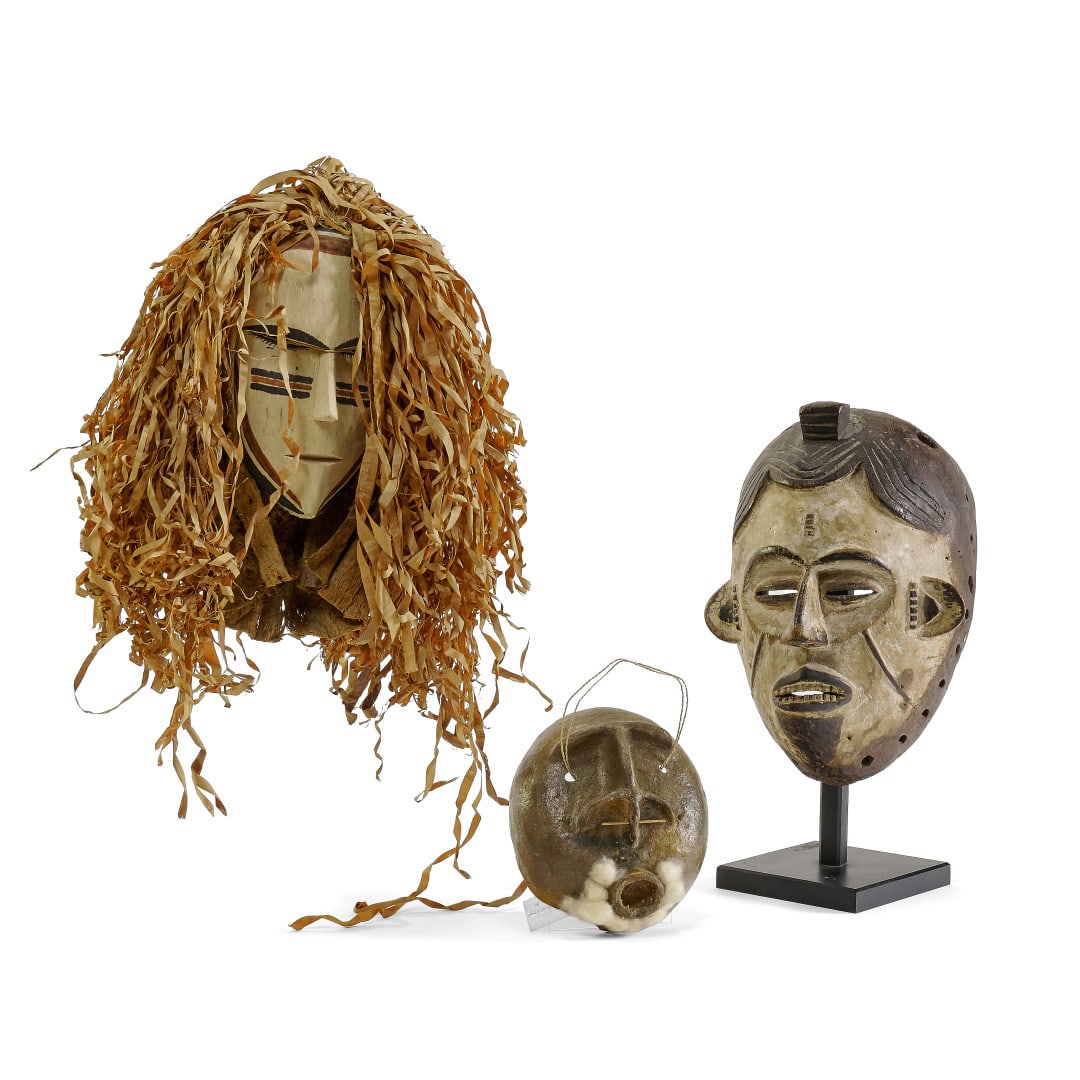 Three masks Africa and Brasil, 20th century: Wood and ceramic. 15.7 x 15.7 x 3.5 in. the largest