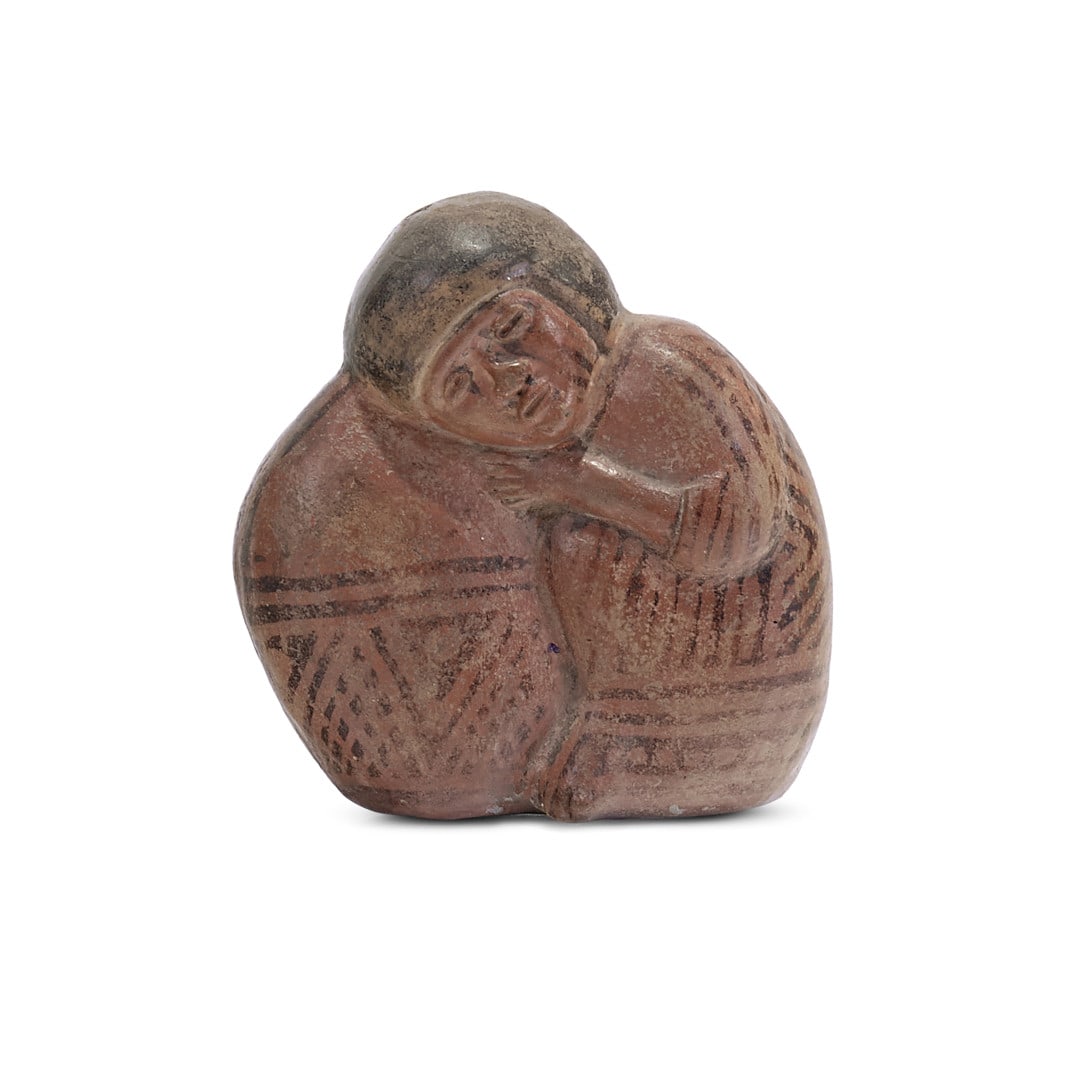 Resting boy Ecuador, Negative Carchi culture, 500-1500 AD: Painted earthenware, the figure leaning on a sack. 4.3 x 3.9 x 1.6 in. Bibliografia/Literature Zanetti G. (a cura di), Prima dell’America. 4000 anni di arte precolombiana, catalogo della mostra di