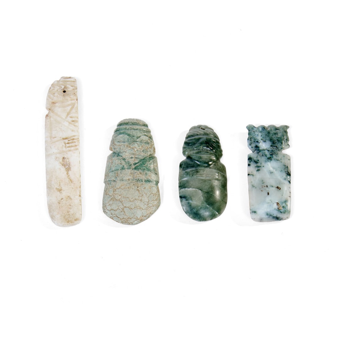 Four pendants Costa Rica, Pre-Columbian period: Sculpted and incised stone. 4.1 x 1 in. the largest