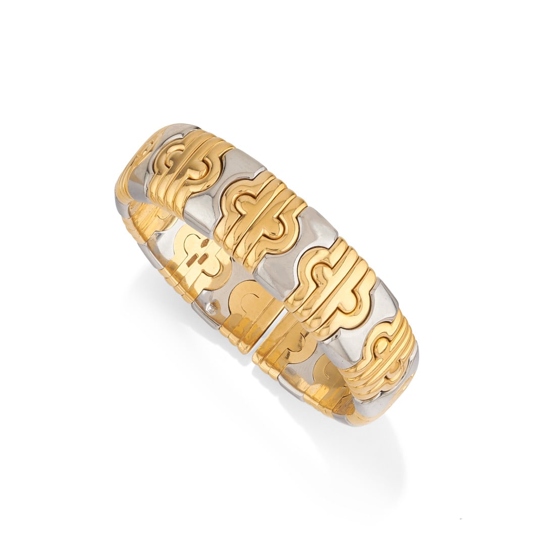 BRACCIALE IN ACCIAIO E ORO GIALLO "PARENTESI", BULGARI - STEEL AND YELLOW GOLD BRACELET: a maglia elastica. Firmato Bulgari. Gr 64,60 - cm 15,00 x 1,40 - designed as a flexible band. Signed Bulgari. Gr 64,60 - cm 15,00 x 1,40