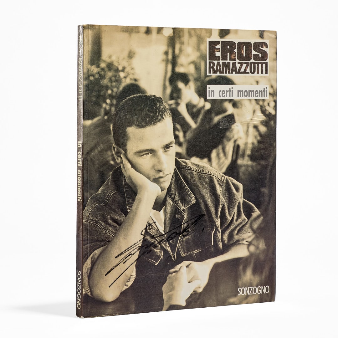 EROS RAMAZZOTTI In Certi Momenti 1987: Biographical volume dedicated to the artist, published by Gruppo Editoriale Fabbri, Bompiani, Sonzogno, Etas S.p.A., with autograph signature on the cover, covering key events in his life, personal