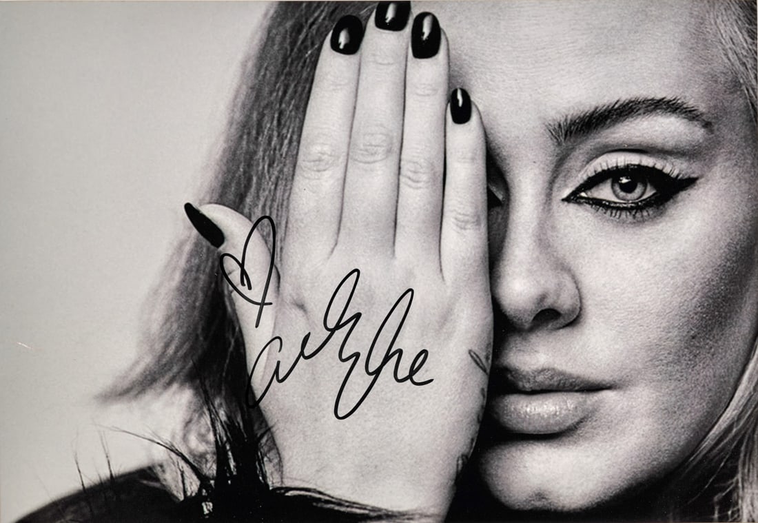 ADELE Signed photographic print: Signed photographic print depicting the artist 7.87 x 11.81 in.