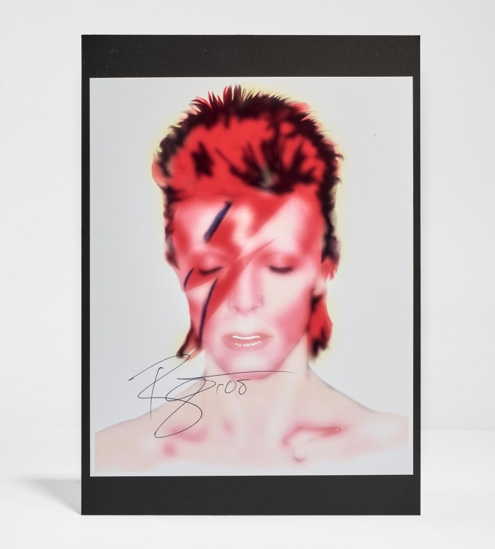 DAVID BOWIE Iconic photograph signed and authenticated by W.C. Alwright: Photographic print connected to the of Aladdin Sane (1973), one of the most revealing and fragile moments in David Bowie’s metamorphosis. Born from the idea of “A Lad Insane”,