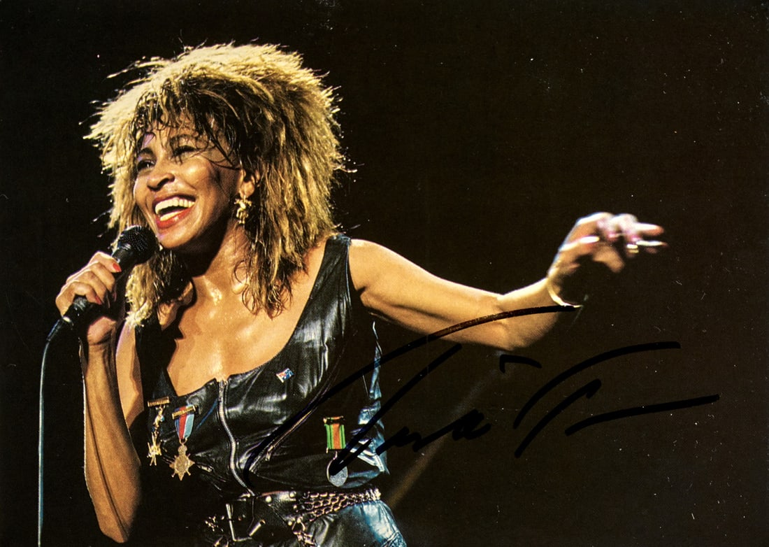 TINA TURNER Signed Card: Card with artists image in a concert, with an autograph signature 3.94 x 5.71 in.