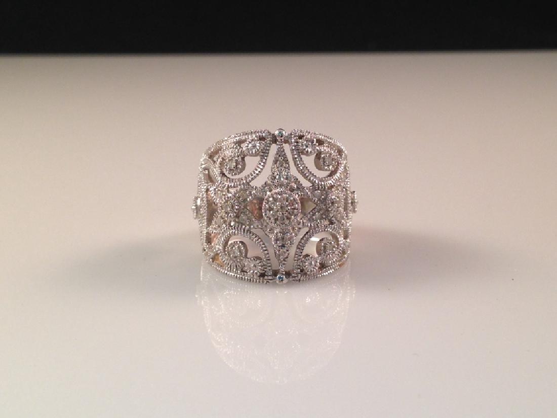 14K WG Diamond 'Cigar Band' Ring.: This sparkling vintage 14K white gold 'Cigar band' style ring is a filigree design with pave diamonds. The ring is stamped '14K' and will fit size 7. It measures about 3/4" at the widest and weighs ap