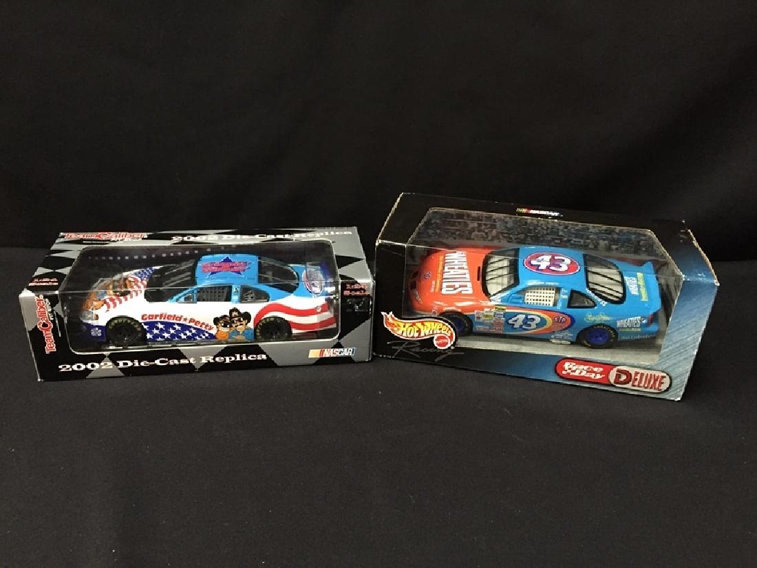 (2) Hot Wheels & Team Cailber 1:24 Scale Cars: Up next, we have a pair of vintage, 1:24 scale Die Cast cars. One is a 2002, Team Caliber Garfield/Petty replica, the other is a 1999 Hot Wheels Wheaties #43 car. Both are new in sealed boxes. Please