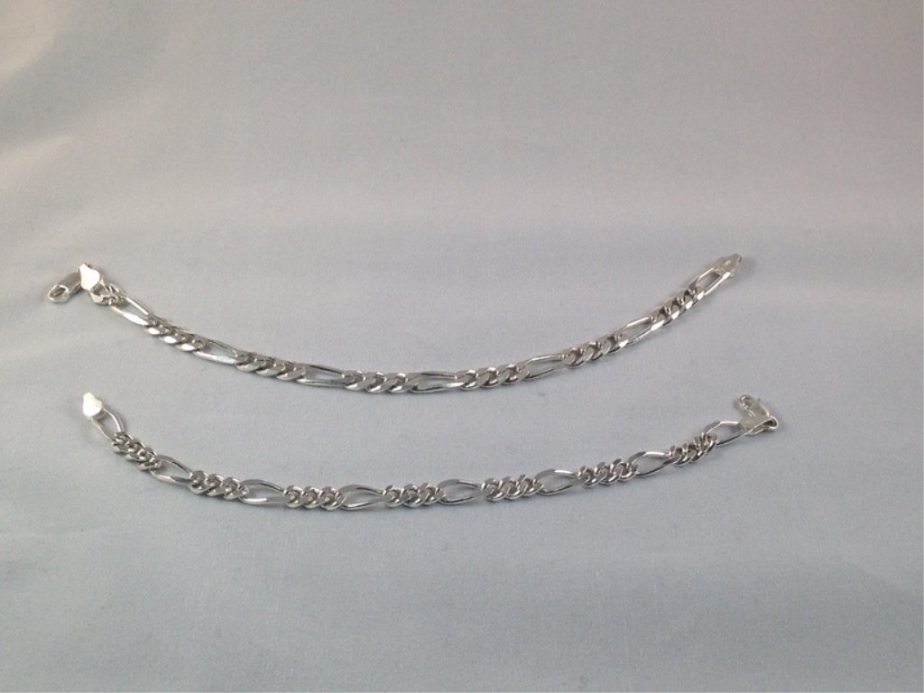 (2) Vintage Sterling Silver Link Bracelets.: The two vintage Sterling Silver bracelets in this lot are both in the Figaro pattern. One bracelets is about 7-1/2" long and the other is about 8-1/2" long. Both bracelets have lobster claw clasps and