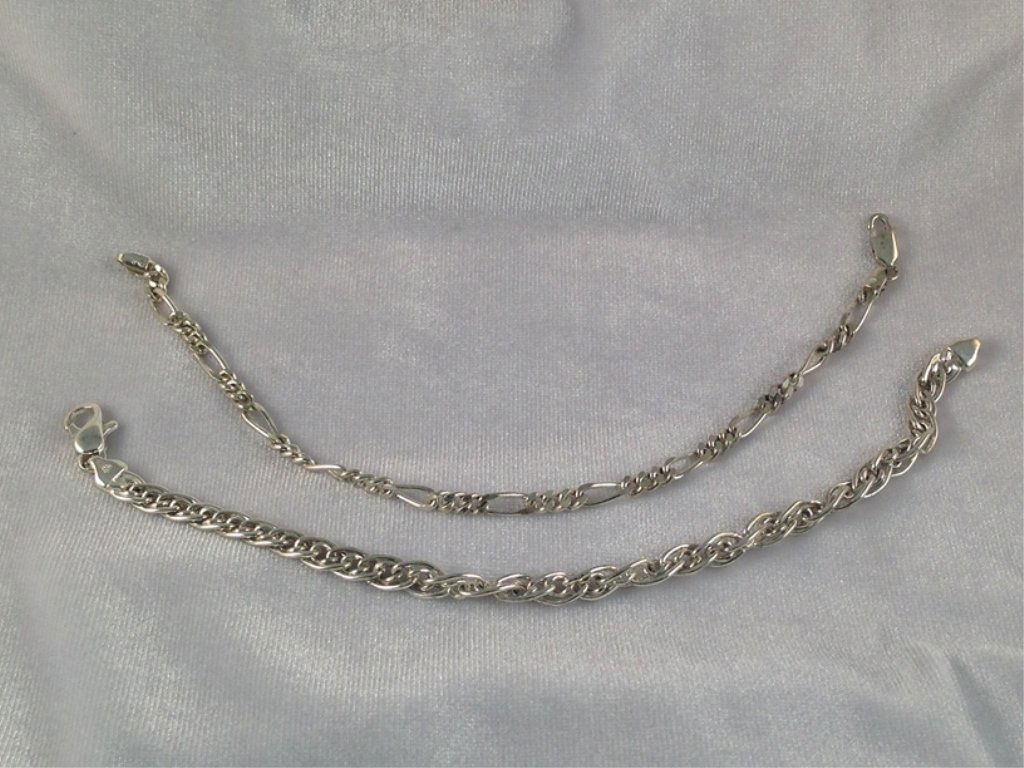 (2) Vintage Sterling Silver Link Bracelets.: Both vintage bracelets in this lot measure about 8-1/4" long and have lobster claw clasps stamped 925 ITALY. One bracelet has the Figaro pattern and the other has the Gucci link pattern. Together the