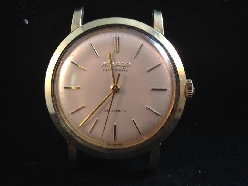Vintage MOVADO 'Bumper' Movement 28j Watch.: This RARE vintage MOVADO gold tone watch has 'bumper' movement and is currently running. The watch case is stamped '6999' and measures about 33mm. The face has gold Roman Numerals and is marked 'MOVAD